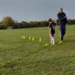 albie high fiving coach james