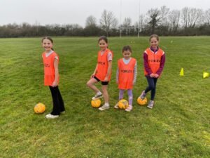 Girls Group Sessions team orange pass and move girls session
